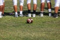 Football placed on field Ã¢â¬â Players getting ready for the game Royalty Free Stock Photo